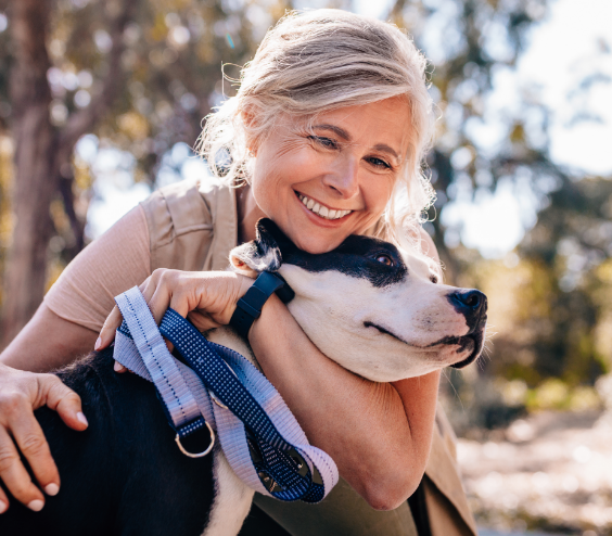 Woman smiling with her dog